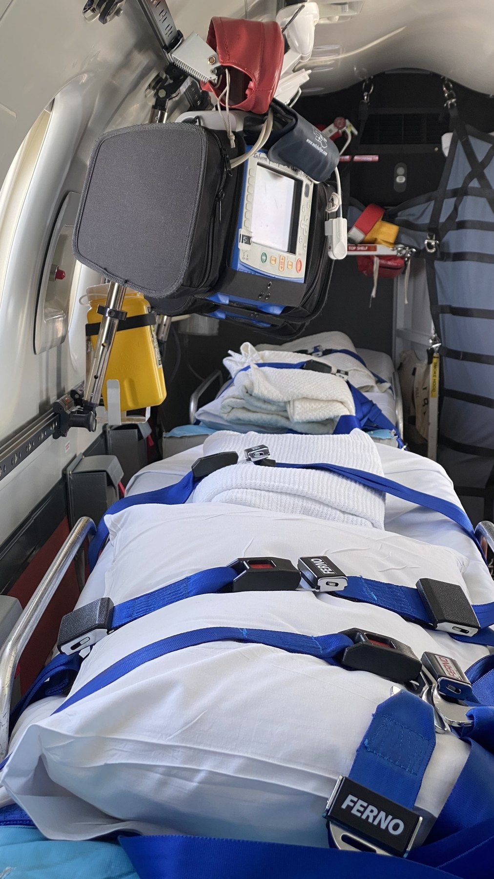 Interior of an air ambulance with stretcher and monitoring equipment.